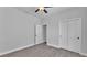 Bedroom with gray walls, a ceiling fan, wood-look flooring, and closet at 5508 Odom, Lakeland, FL 33809