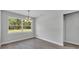 Inviting dining area with large window, chandelier and wood-look tile flooring at 5508 Odom, Lakeland, FL 33809