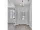 Elegant front entry with decorative glass door and modern lighting fixture at 5508 Odom, Lakeland, FL 33809