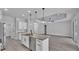 Open concept kitchen featuring white cabinets and marble countertops at 5508 Odom, Lakeland, FL 33809