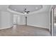 Bright, open living area with tile floors, tray ceilings, and modern lighting at 5508 Odom, Lakeland, FL 33809