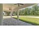 The covered patio overlooks a spacious backyard, perfect for outdoor relaxation and entertaining at 5508 Odom, Lakeland, FL 33809