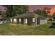 This home has a covered patio, and a spacious green backyard, perfect for outdoor activities and relaxation at 5512 Odom Rd, Lakeland, FL 33809