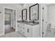 Stylish bathroom with double sink vanity, granite countertops, and modern fixtures at 5512 Odom Rd, Lakeland, FL 33809