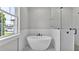 Modern bathroom featuring glass shower and soaking tub near the window at 5512 Odom Rd, Lakeland, FL 33809