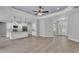 Expansive living space featuring sleek flooring, an open floor plan, and a modern kitchen at 5512 Odom Rd, Lakeland, FL 33809