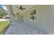 Covered patio with gray stone pavers providing great entertaining space at 5512 Odom Rd, Lakeland, FL 33809