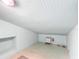 Unfinished attic featuring minimalist interior and storage space at 649 Ave J Nw, Winter Haven, FL 33881