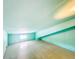 Spacious attic featuring blue walls, ample natural light and room for customization at 649 Ave J Nw, Winter Haven, FL 33881