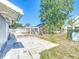 Spacious backyard featuring a concrete patio and pergola at 649 Ave J Nw, Winter Haven, FL 33881