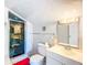 Tiled bathroom features a walk-in shower and vanity at 649 Ave J Nw, Winter Haven, FL 33881
