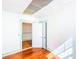 Bright room with hardwood floors, fresh paint, and an open doorway at 649 Ave J Nw, Winter Haven, FL 33881