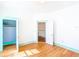 Bright room with hardwood floors, fresh paint, and open closet at 649 Ave J Nw, Winter Haven, FL 33881