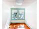 Bright room with hardwood floors, fresh paint, and large windows at 649 Ave J Nw, Winter Haven, FL 33881