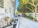 Driveway with koi pond and mature landscaping at 649 Ave J Nw, Winter Haven, FL 33881