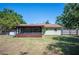 Home exterior with screened in porch and large backyard at 6529 Farris Dr, Lakeland, FL 33811