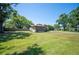 Home exterior with large, grassy backyard at 6529 Farris Dr, Lakeland, FL 33811