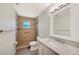 Bathroom featuring a tiled shower with a built-in seat and a modern vanity at 6529 Farris Dr, Lakeland, FL 33811