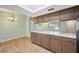 Well-lit kitchen featuring wooden cabinetry and a spacious layout at 6529 Farris Dr, Lakeland, FL 33811
