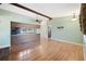 Spacious living room with hardwood floors and a beam ceiling at 6529 Farris Dr, Lakeland, FL 33811