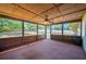 Enclosed, carpeted sunroom with ceiling fan overlooking a pool and lush backyard at 6529 Farris Dr, Lakeland, FL 33811