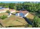 Aerial view of property showcasing fenced yard, patio set, and well-maintained lawn, offering a glimpse of outdoor living at 737 Kensington St, Lakeland, FL 33803