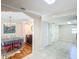 Spacious open concept floor plan with dining area connected to tiled living area at 737 Kensington St, Lakeland, FL 33803