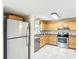 Well-equipped kitchen with stainless steel appliances and wood cabinetry at 737 Kensington St, Lakeland, FL 33803