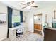 Cozy office space with large window, ceiling fan, and hardwood floors at 737 Kensington St, Lakeland, FL 33803