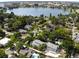 Aerial view showcasing the neighborhood, nearby lake, and the home's private pool at 746 Mississippi Ave, Lakeland, FL 33801