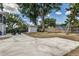 Wide backyard view with chairs and detached garage provides outdoor leisure and storage space at 746 Mississippi Ave, Lakeland, FL 33801
