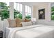Comfortable bedroom featuring a plush bed, side tables, and bright natural light at 746 Mississippi Ave, Lakeland, FL 33801