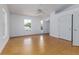 Bright bedroom featuring a ceiling fan, wood floors, closet and many windows for a light filled comfortable space at 746 Mississippi Ave, Lakeland, FL 33801