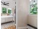 Inviting bedroom view featuring a cozy bed, modern lighting, and a stylish rug at 746 Mississippi Ave, Lakeland, FL 33801