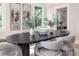 Close up of a stylish dining table with decor, gray chairs, and bright natural light at 746 Mississippi Ave, Lakeland, FL 33801