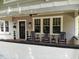 Inviting front porch featuring rocking chairs and charming details on a beautifully maintained home at 746 Mississippi Ave, Lakeland, FL 33801