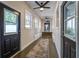Bright hallway with tile flooring, neutral walls, and multiple entryways at 746 Mississippi Ave, Lakeland, FL 33801