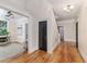 View of the naturally lit hallway and office space featuring hardwood floors at 746 Mississippi Ave, Lakeland, FL 33801