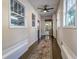 Hallway with tile floor, rug, natural light and many windows to the outside at 746 Mississippi Ave, Lakeland, FL 33801