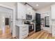 Kitchen view with stainless appliances, and black accent doors leading to the dining room at 746 Mississippi Ave, Lakeland, FL 33801