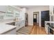Bright, renovated kitchen featuring white cabinets, stainless steel appliances, and modern finishes at 746 Mississippi Ave, Lakeland, FL 33801
