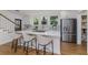 Large kitchen boasts an island with seating, white cabinets, stainless steel appliances, and open layout at 746 Mississippi Ave, Lakeland, FL 33801