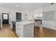 Open concept kitchen and living area featuring an island with oven and seating at 746 Mississippi Ave, Lakeland, FL 33801