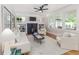 Bright living room features fireplace, built-in bookshelves, neutral decor, and hardwood floors at 746 Mississippi Ave, Lakeland, FL 33801