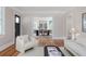 Inviting living room with hardwood floors offers a view into the dining area at 746 Mississippi Ave, Lakeland, FL 33801