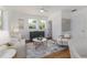 Naturally lit living room features stylish decor, wood flooring, and neutral paint at 746 Mississippi Ave, Lakeland, FL 33801