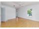 Spacious primary bedroom with natural light, wood floors, and backyard views at 746 Mississippi Ave, Lakeland, FL 33801
