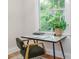 Bright office space with modern desk and chair in front of a large window at 746 Mississippi Ave, Lakeland, FL 33801