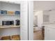 Walk-in pantry includes microwave, coffee maker and ample storage space at 746 Mississippi Ave, Lakeland, FL 33801