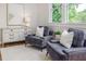 Comfortable sitting room featuring stylish seating, elegant decor, and abundant natural light at 746 Mississippi Ave, Lakeland, FL 33801